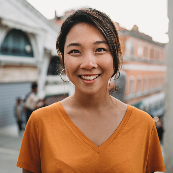 young woman in orange shirt