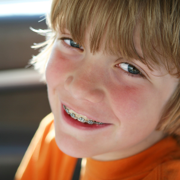 young boy with braces