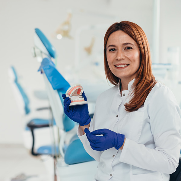 A dentist showing a denture
